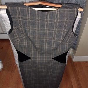 Work dress with leather waist design.